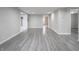 Spacious basement with gray laminate flooring and neutral walls at 1141 Temperance Ave, Indianapolis, IN 46203