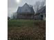Two-story house with brick and siding, situated on a grassy lot at 1207 W 35Th St, Indianapolis, IN 46208