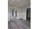 Living room with new gray flooring and drywall at 1207 W 35Th St, Indianapolis, IN 46208