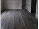 New gray vinyl flooring in a living room under construction at 1207 W 35Th St, Indianapolis, IN 46208