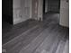 New gray flooring in a room under renovation at 1207 W 35Th St, Indianapolis, IN 46208