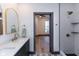 Bathroom with double vanity and view of bedroom at 1510 S Talbott St, Indianapolis, IN 46225