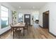 Dining room with hardwood floors and a view into the living room at 1510 S Talbott St, Indianapolis, IN 46225