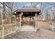 Wooden gazebo with string lights and seating area at 154 E Thompson Rd, Indianapolis, IN 46227