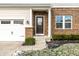 Inviting front entrance with a dark brown door and brick facade at 1862 Sterling Ct, Greenwood, IN 46143