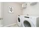 Bright laundry room with washer, dryer, and storage at 18703 Moray St, Westfield, IN 46074