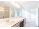 Double sink bathroom with a large mirror and grey tile floor at 239 Ambassador Dr, Pittsboro, IN 46167