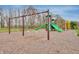 Community playground with swings and play structure at 239 Ambassador Dr, Pittsboro, IN 46167