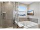 Bathroom with soaking tub and walk-in shower at 2707 Southward Dr, Greenwood, IN 46143