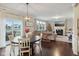 Bright dining area with hardwood floors, and view to the living room and backyard at 2707 Southward Dr, Greenwood, IN 46143