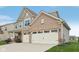 Two-story home with a three-car garage, brick and siding exterior at 2707 Southward Dr, Greenwood, IN 46143