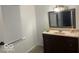 Bathroom with vanity, mirror, and window blinds at 323 E Franklin St, Shelbyville, IN 46176
