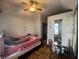Main bedroom with a queen bed and hardwood floors at 323 E Franklin St, Shelbyville, IN 46176