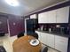 Kitchen dining area with round table and chairs at 323 E Franklin St, Shelbyville, IN 46176