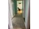Gray hallway with new flooring, connecting to living room at 323 E Franklin St, Shelbyville, IN 46176