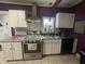 Kitchen with stainless steel appliances and granite countertops at 323 E Franklin St, Shelbyville, IN 46176