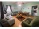 Open concept living and dining area with hardwood floors at 323 E Franklin St, Shelbyville, IN 46176