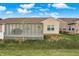 View of the back of house, deck, lattice fence and yard at 3275 Eaton Mews Ct, Greenwood, IN 46143