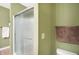 Bathroom with shower, toilet and light green walls at 3275 Eaton Mews Ct, Greenwood, IN 46143