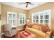 Relaxing sunroom featuring hardwood floors and large windows at 3275 Eaton Mews Ct, Greenwood, IN 46143