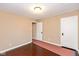 Spacious bedroom with hardwood floors and two doors at 3709 Fletcher Ave, Indianapolis, IN 46203