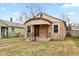 Charming bungalow with stone facade, updated landscaping, and a welcoming front porch at 3709 Fletcher Ave, Indianapolis, IN 46203