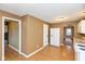 View of kitchen with white appliances and wood flooring at 3709 Fletcher Ave, Indianapolis, IN 46203