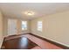 Spacious living room featuring hardwood floors and ample natural light at 3709 Fletcher Ave, Indianapolis, IN 46203