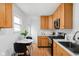 Bright kitchen with oak cabinets, stainless steel appliances, and a breakfast nook at 4630 Young Ave, Indianapolis, IN 46201