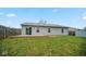 Backyard view showing home, deck, and grassy area at 6369 River Valley Way, Indianapolis, IN 46221