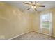 Simple bedroom with ceiling fan and neutral carpeting at 6369 River Valley Way, Indianapolis, IN 46221