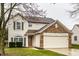 Charming two-story home with a brick and siding exterior, attached garage, and landscaped front yard at 6771 Lexington Cir, Zionsville, IN 46077