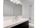 Modern bathroom with dark vanity and white fixtures at 7909 Benjamin Dr, Indianapolis, IN 46226