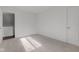 Well-lit bedroom with neutral carpeting and ample space at 7909 Benjamin Dr, Indianapolis, IN 46226