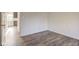 Bright bedroom with neutral walls and wood-look flooring at 7909 Benjamin Dr, Indianapolis, IN 46226