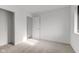 Bright bedroom with neutral carpeting and ample closet space at 7909 Benjamin Dr, Indianapolis, IN 46226
