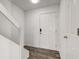 Bright entryway with stairs, wood flooring, and storage at 7909 Benjamin Dr, Indianapolis, IN 46226