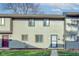 Attractive townhouse exterior with landscaping and a neat lawn at 7909 Benjamin Dr, Indianapolis, IN 46226