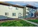 Updated townhouse exterior with a well-maintained lawn at 7909 Benjamin Dr, Indianapolis, IN 46226