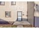 Townhouse entrance with a security door and landscaping at 7909 Benjamin Dr, Indianapolis, IN 46226