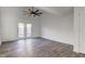 Bright living room with wood flooring, vaulted ceiling, and patio doors at 7909 Benjamin Dr, Indianapolis, IN 46226
