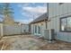 Private patio with adjacent AC unit and fenced yard at 7909 Benjamin Dr, Indianapolis, IN 46226