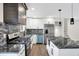 Modern kitchen with white cabinets, granite countertops and stainless steel appliances at 8327 Crousore Rd, Indianapolis, IN 46219