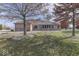 House backyard with grass, trees, and landscaping at 9048 N Watson Meadows Ln, Mooresville, IN 46158