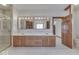 Bathroom with double vanity, large mirror, and shower at 9048 N Watson Meadows Ln, Mooresville, IN 46158