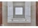 Bathroom features a large garden tub and a window at 9048 N Watson Meadows Ln, Mooresville, IN 46158