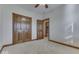Bedroom with double doors and ceiling fan at 9048 N Watson Meadows Ln, Mooresville, IN 46158