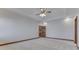 Bright bedroom with ceiling fan and access to bathroom at 9048 N Watson Meadows Ln, Mooresville, IN 46158