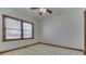 Bright bedroom with ceiling fan and window at 9048 N Watson Meadows Ln, Mooresville, IN 46158