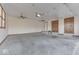 Large unfinished garage with two ceiling fans and ample space at 9048 N Watson Meadows Ln, Mooresville, IN 46158